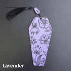 Lavender coffin bookmark with floral patterns on a dark gray background