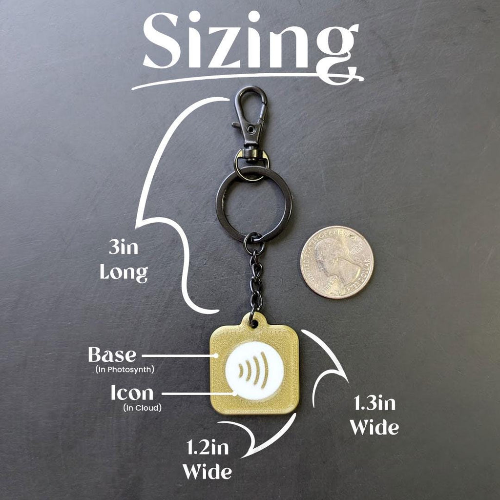 Keychain with measurements on a dark background