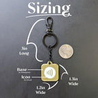Keychain with measurements on a dark background